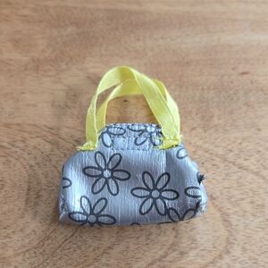 1/5$ 4/15$ 6/20$ Barbie Silver and Yellow Flower Print Handbag